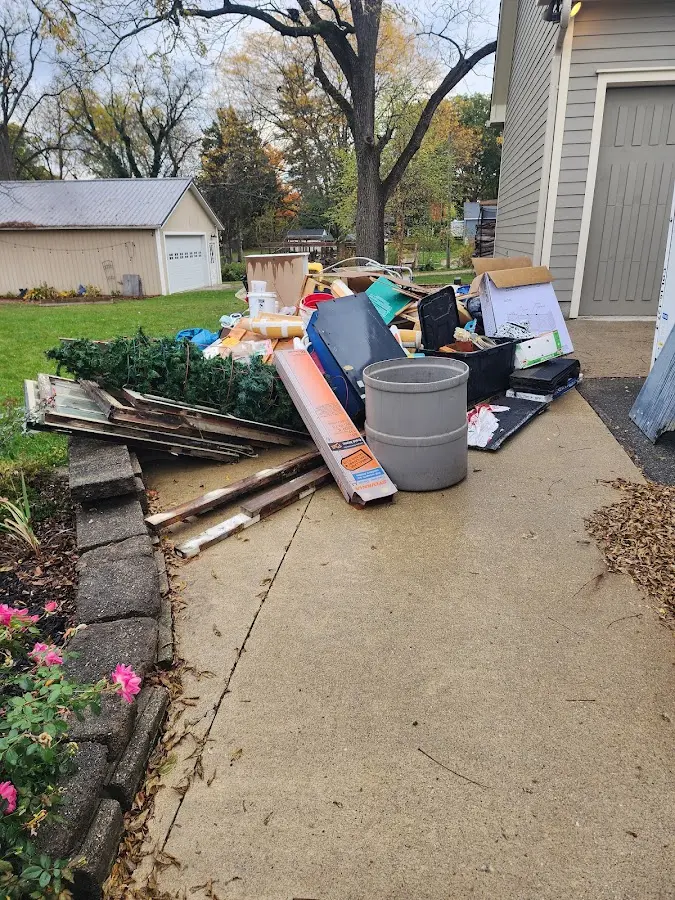 Dumpster being loaded with debris for Demolition Dumpster Rental in Berwick